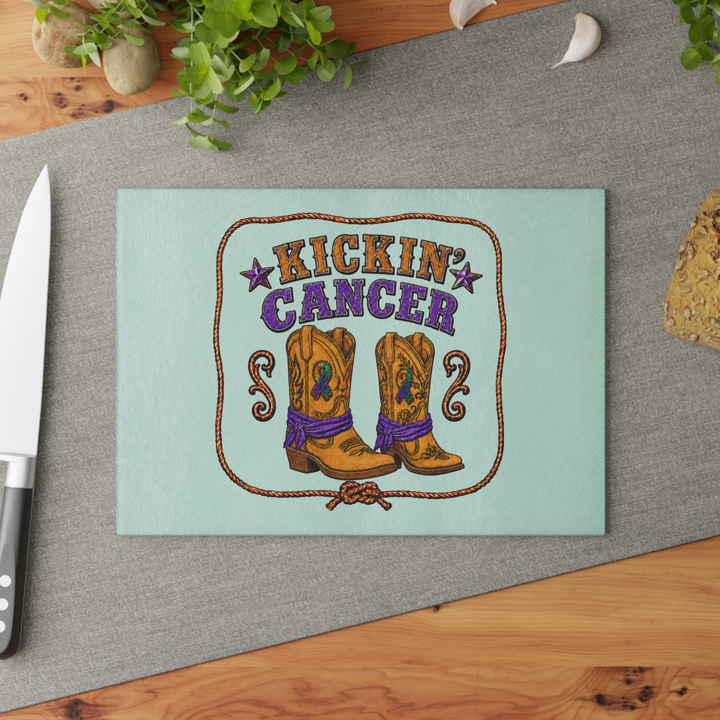 Mint tempered glass cutting board with cowboy boots and Kickin' Cancer design on a kitchen counter