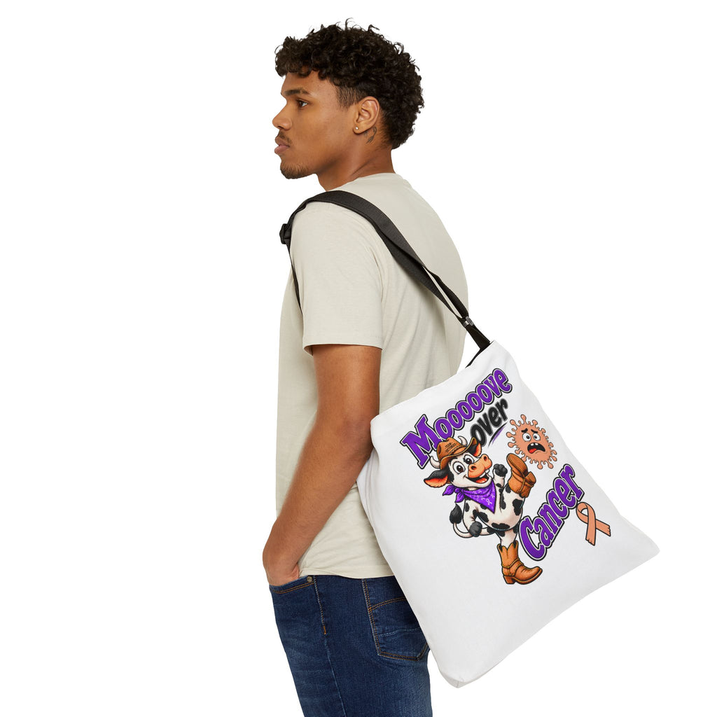 Moooove Over Cancer shoulder tote carried at the side with cow and ribbon artwork
