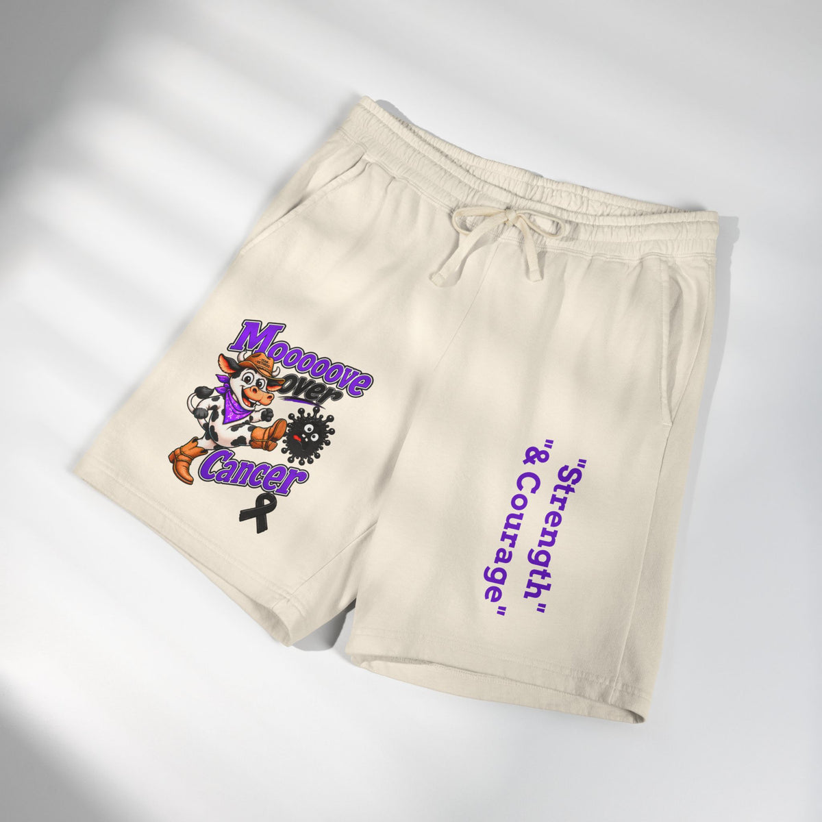 Moooove Over Cancer cream sweat shorts shown at an angle with awareness artwork and Strength & Courage text