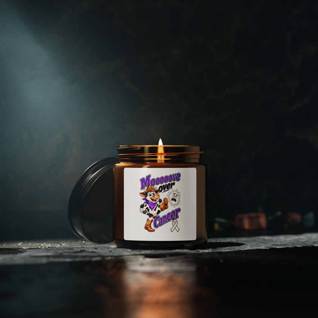 Moooove Over Cancer candle glowing with its Lung Cancer awareness ribbon label