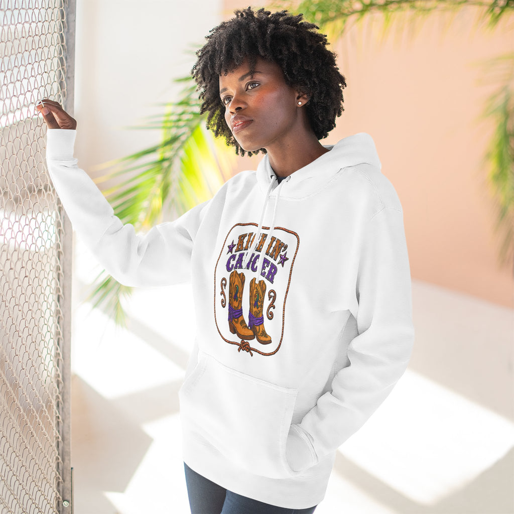 Model wearing a white Kickin' Cancer hoodie with a western boots graphic