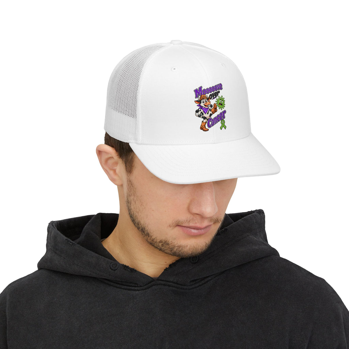 Model wearing a white Moooove Over Cancer trucker cap with colorful front design