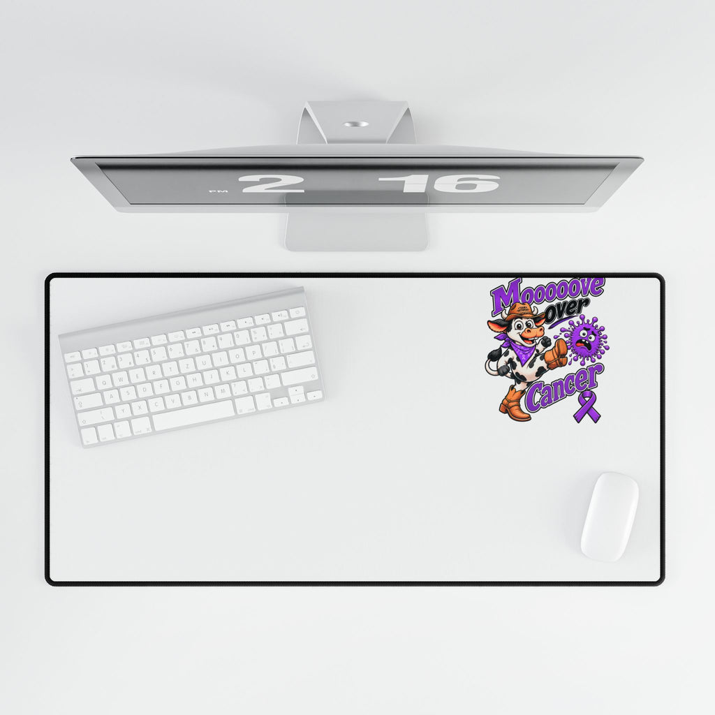 Top view of Moooove Over Cancer desk mat beneath a keyboard and beside a mouse