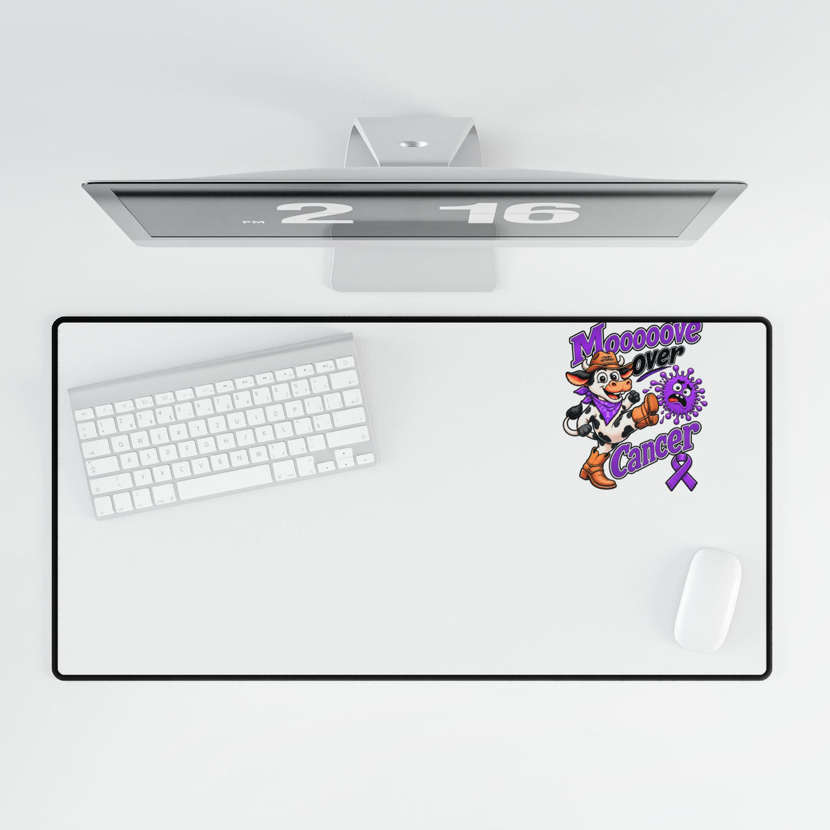 Top view of Moooove Over Cancer desk mat beneath a keyboard and beside a mouse