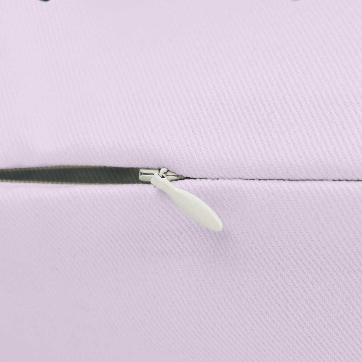 Close-up of the concealed zipper and metal pull on the Kickin' Cancer pillow cover