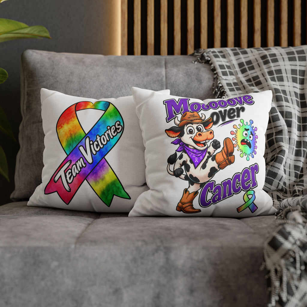 Two Team Victories pillows, including Moooove Over Cancer and an all-cancer awareness ribbon design