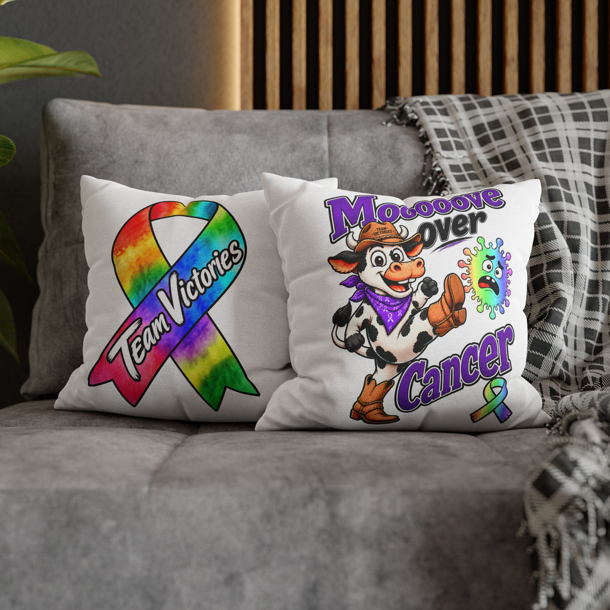 Two Team Victories pillows, including Moooove Over Cancer and an all-cancer awareness ribbon design