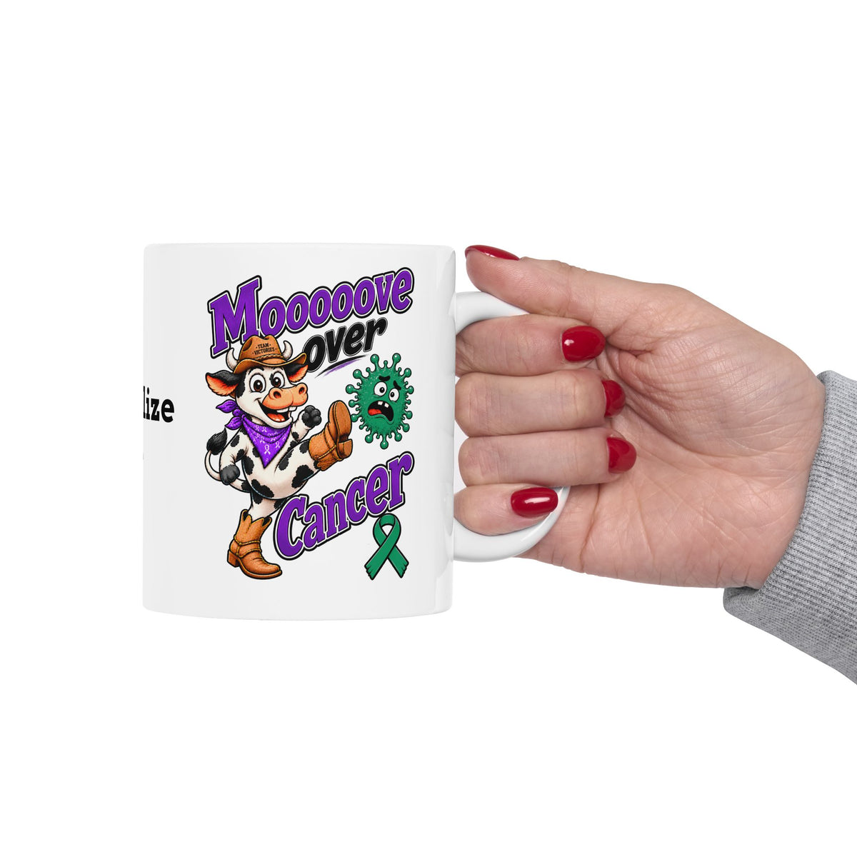 Hand holding a Moooove Over Cancer personalized ceramic mug