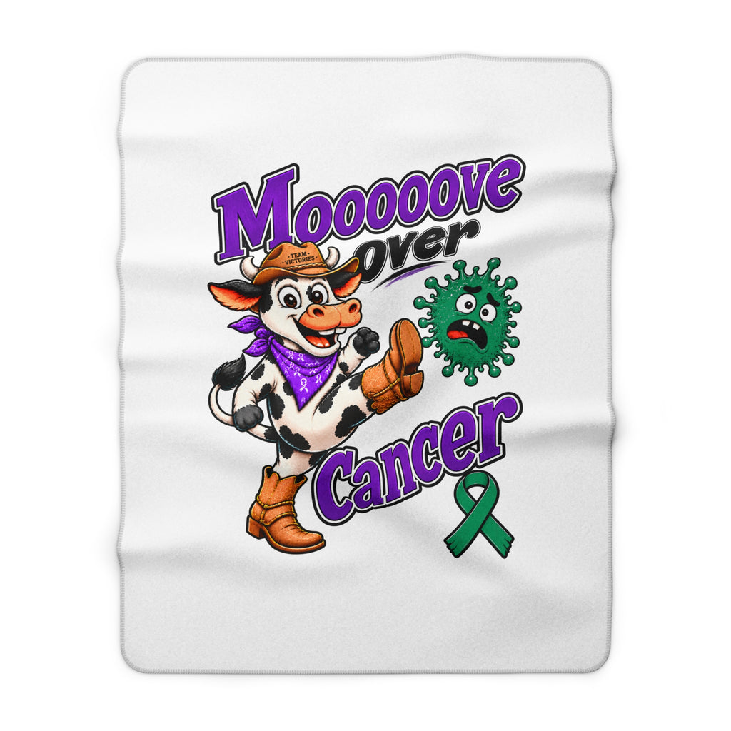 Close view of Moooove Over Cancer blanket with cow artwork and green Liver Cancer awareness ribbon
