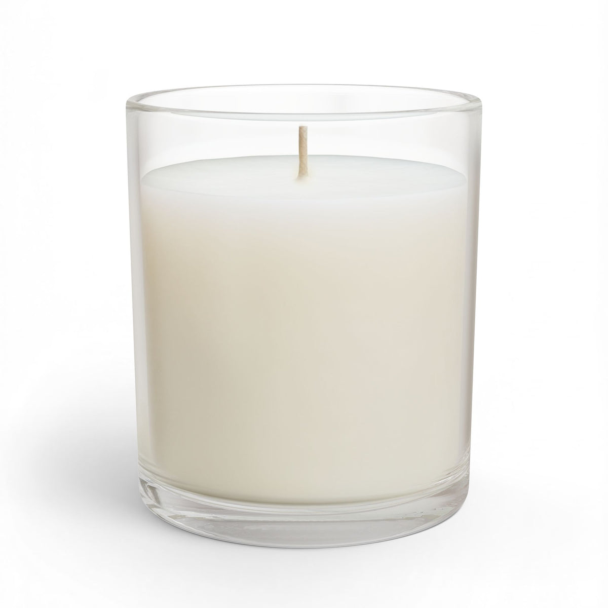 Rear view of a clear glass Kickin’ Cancer soy candle showing its unprinted glass surface
