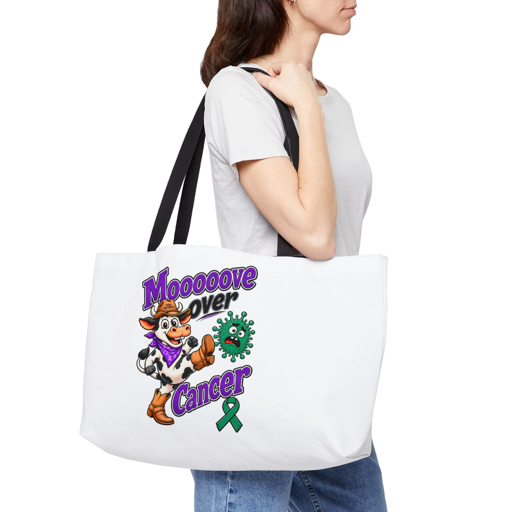 Moooove Over Cancer tote bag worn over the shoulder with colorful cancer support artwork