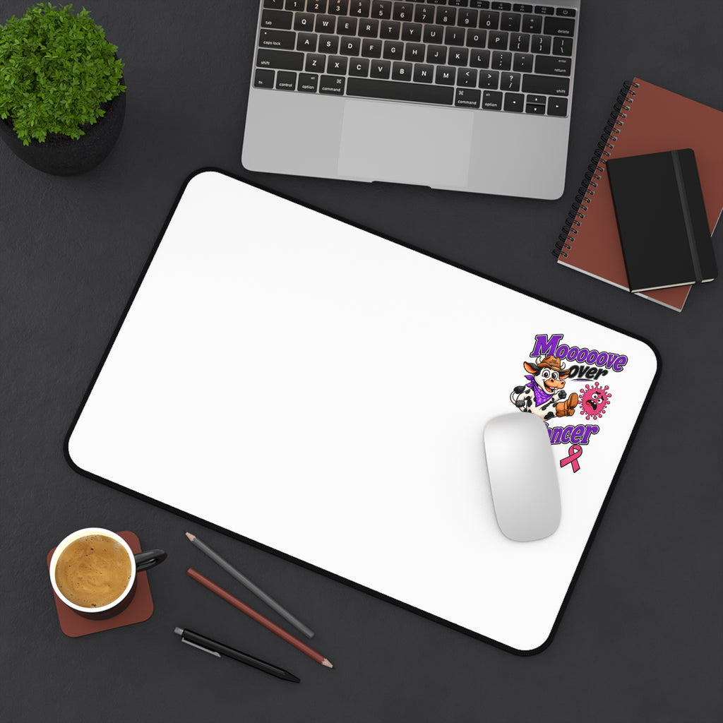 Moooove Over Cancer desk mat shown with a mouse and laptop on a desktop