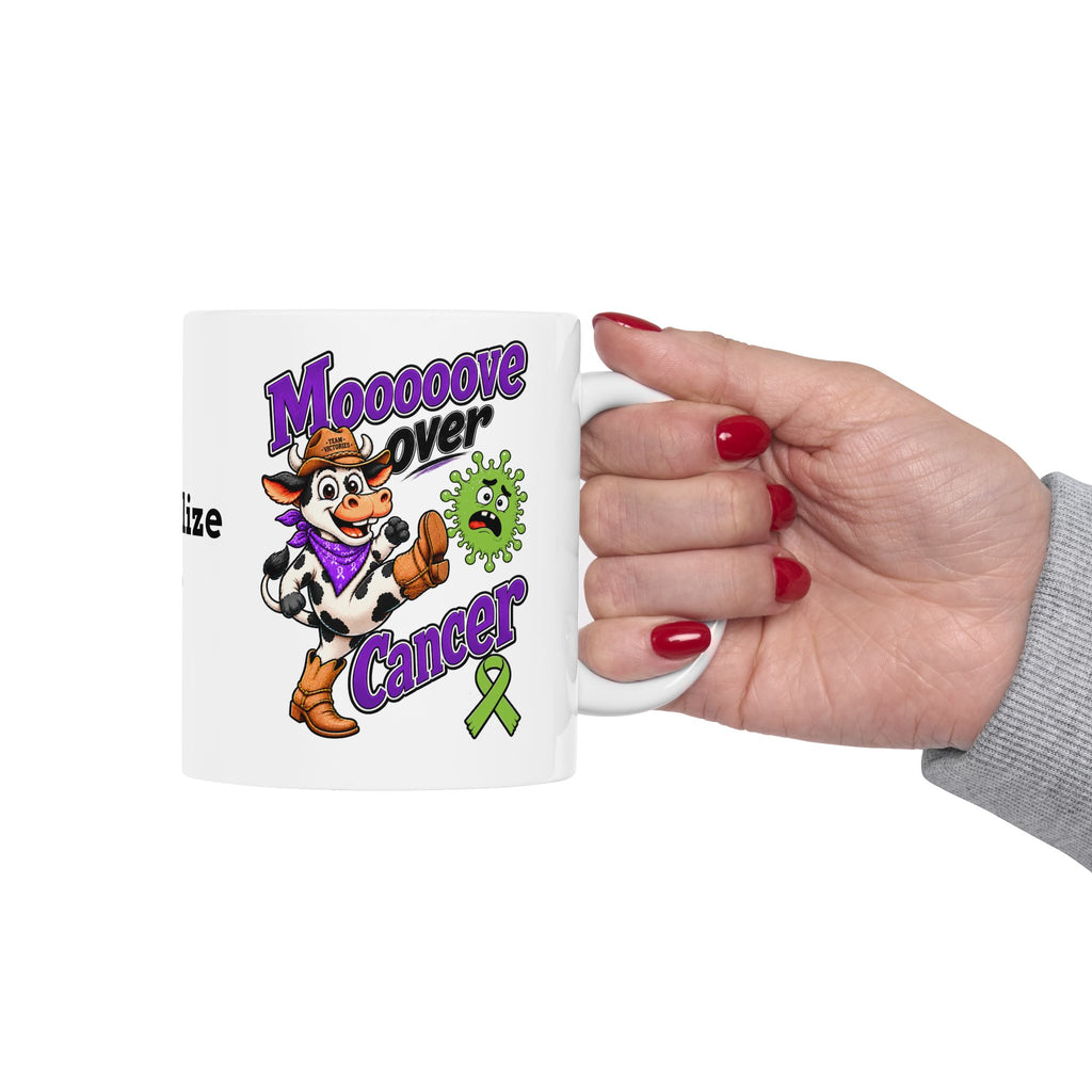 Hand holding a personalized Moooove Over Cancer ceramic mug