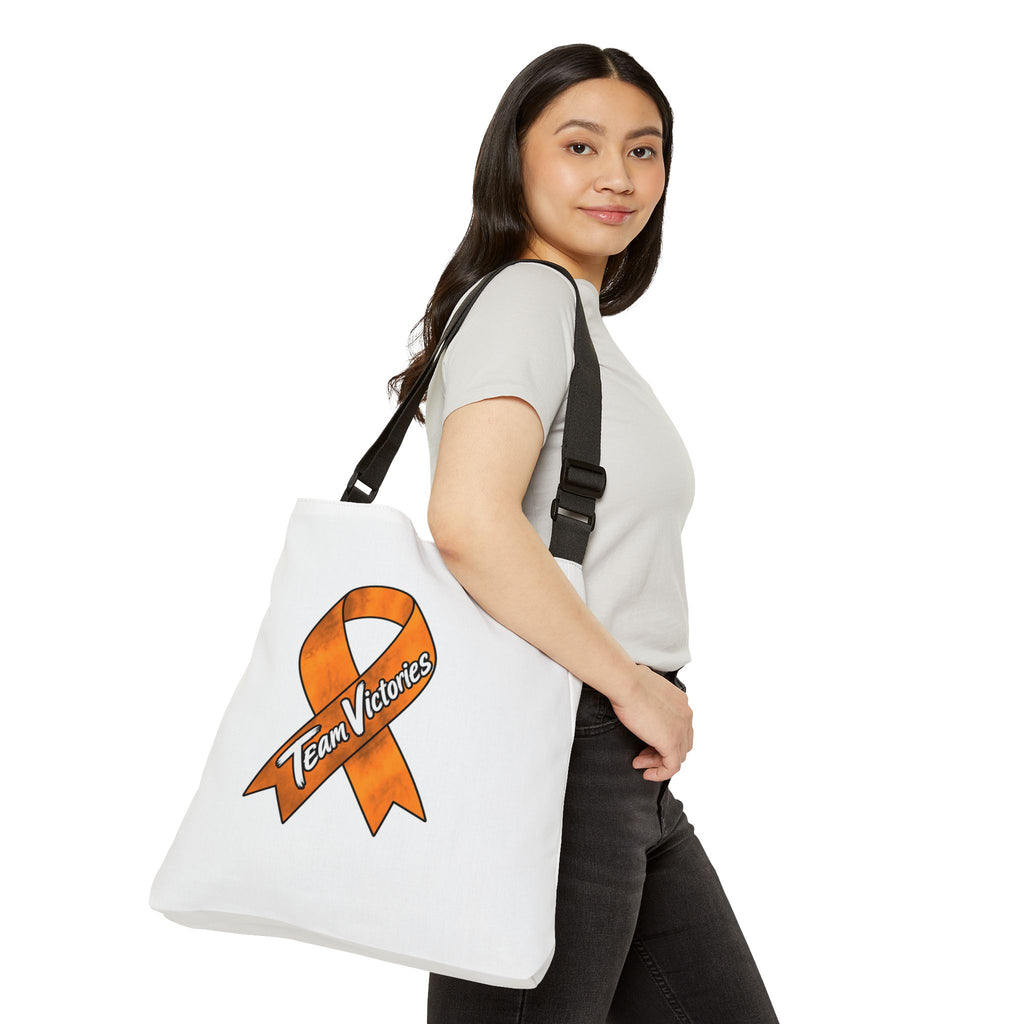 Person carrying the Team Victories orange ribbon shoulder tote