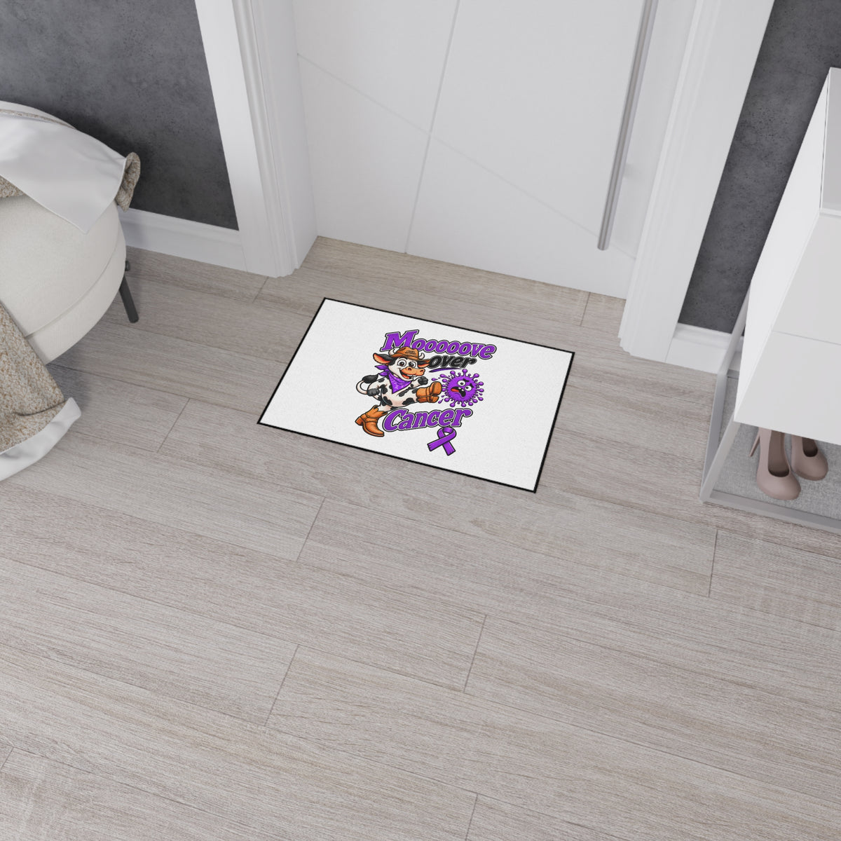 Moooove Over Cancer floor mat positioned near a doorway with cow artwork