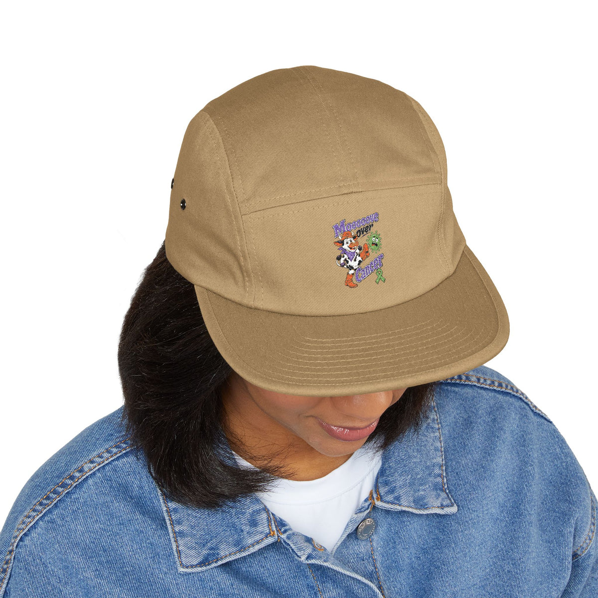 Person wearing tan Moooove Over Cancer embroidered five-panel cap