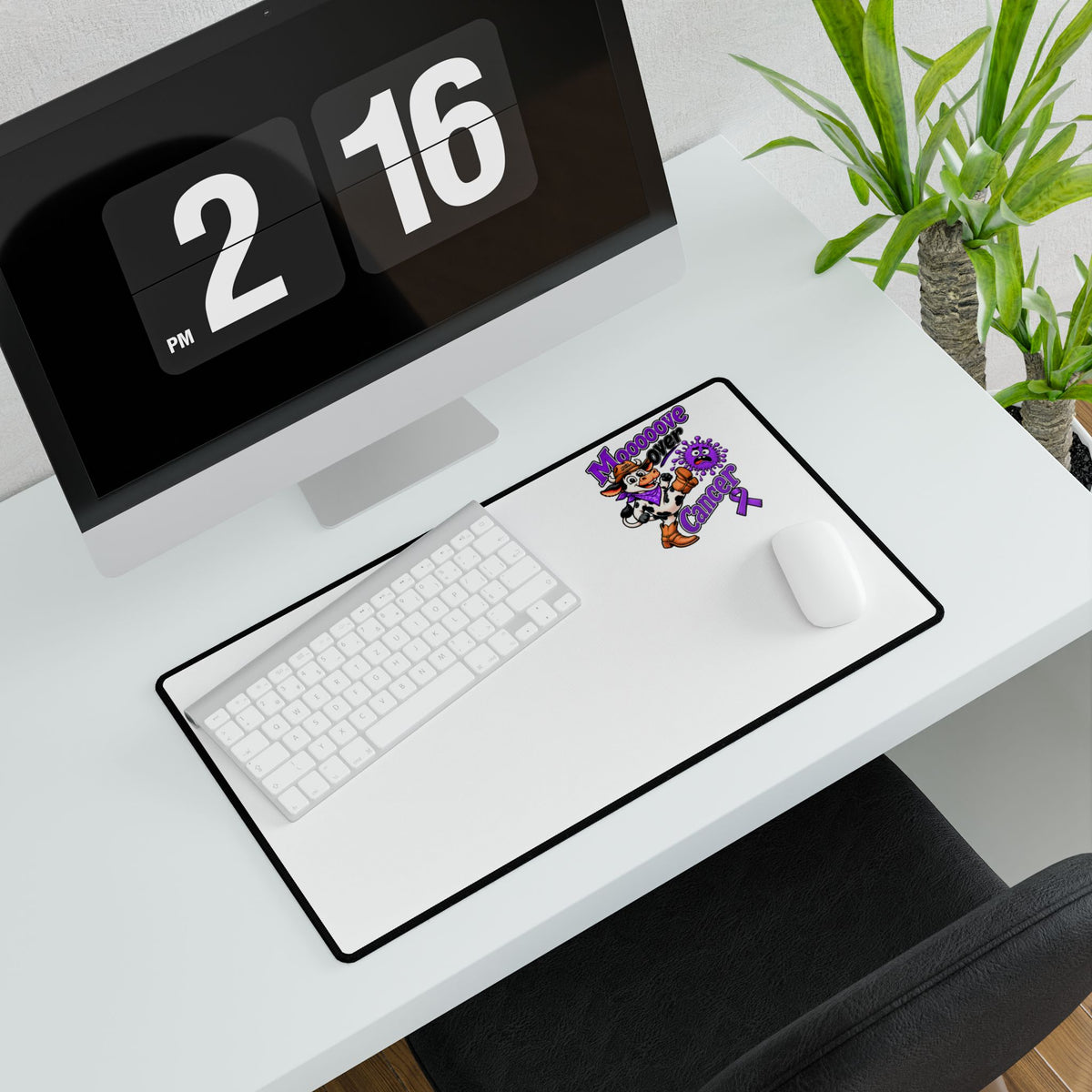 Moooove Over Cancer mouse pad with a white mouse on a desktop