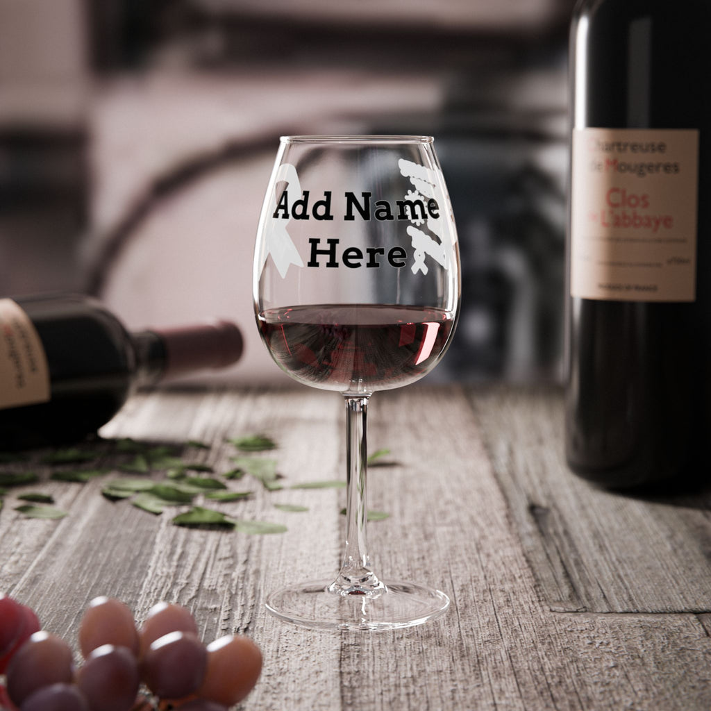 Moooove Over Cancer personalized wine glass on a table beside wine bottles
