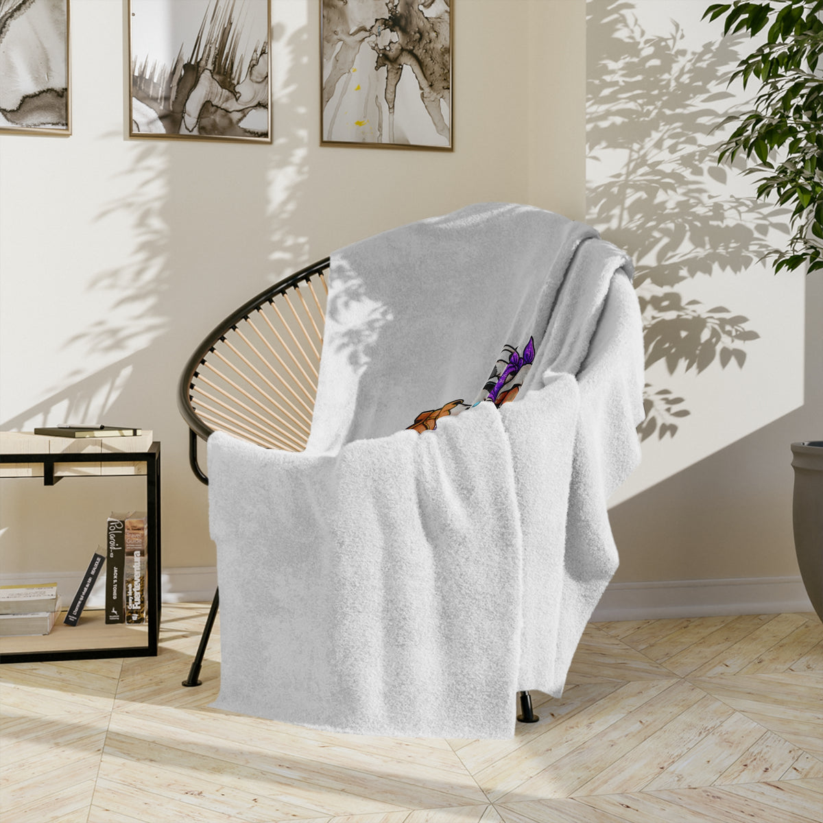 Moooove Over Cancer blanket hanging over a chair with partial artwork showing