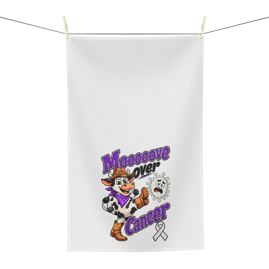 Moooove Over Cancer tea towel hanging with cow artwork and awareness ribbon