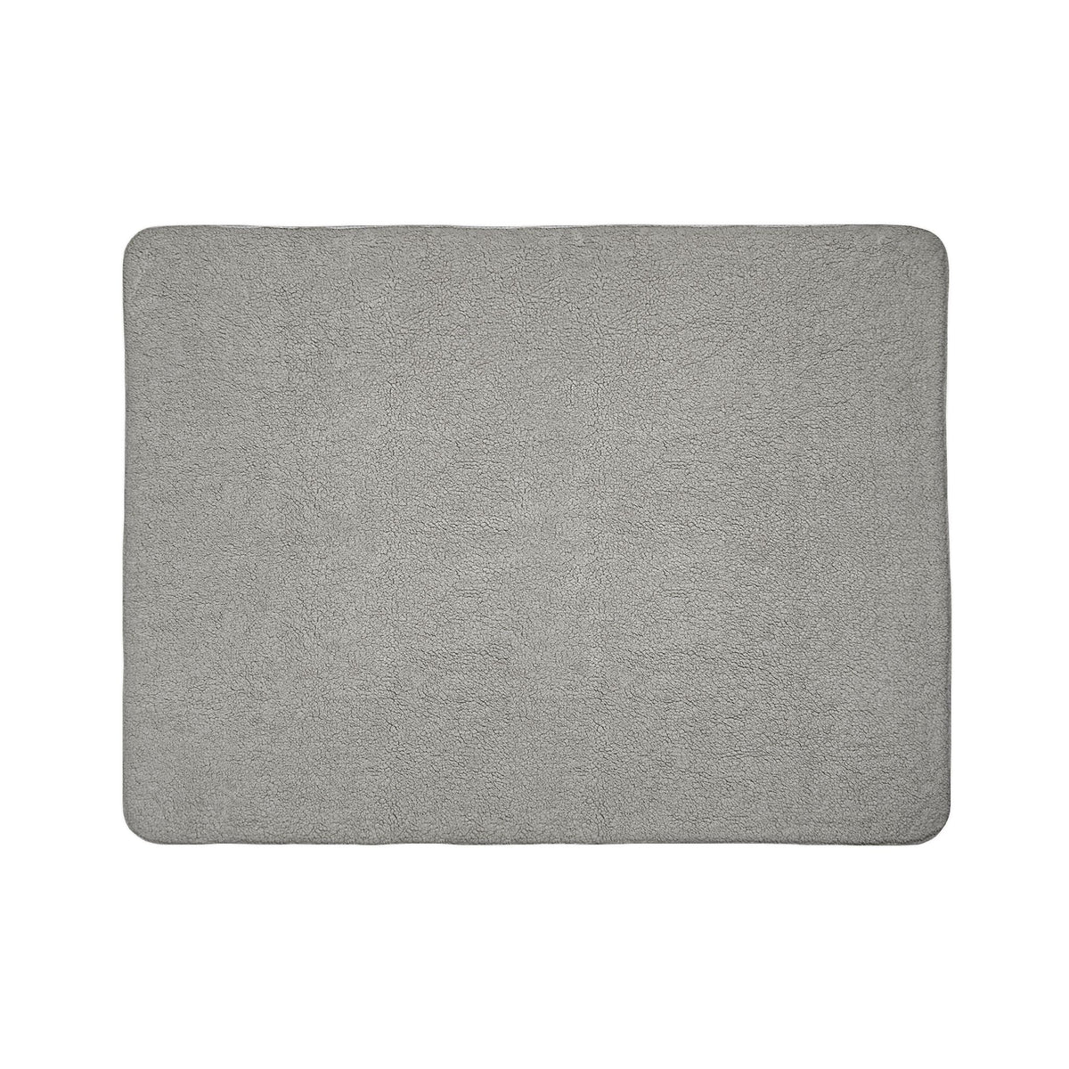 Close view of the blanket's double-sided plush construction and printed edge
