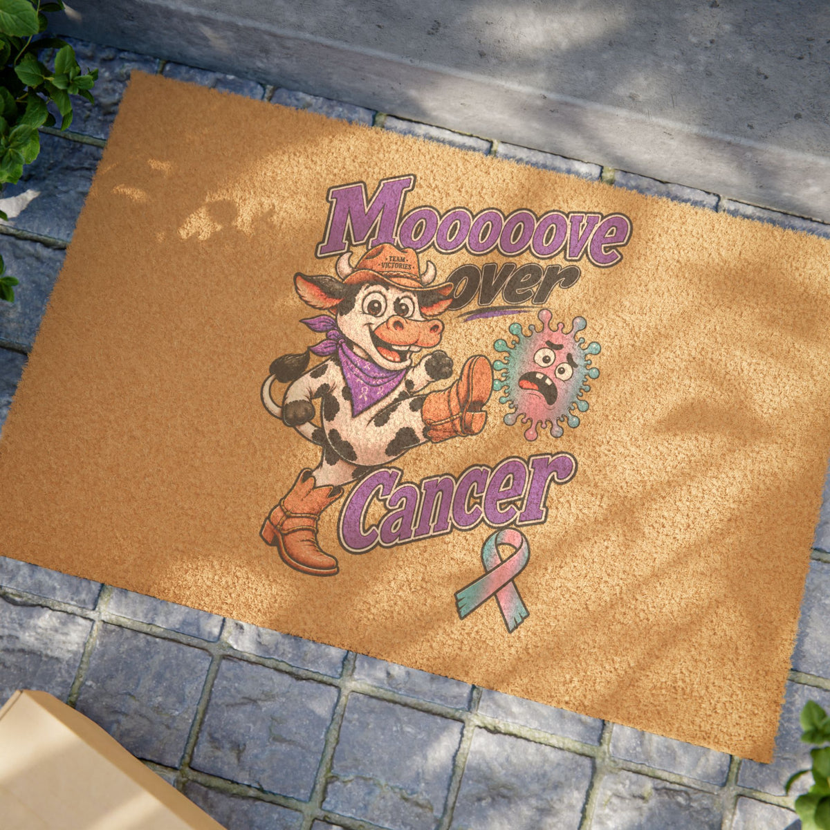 Moooove Over Cancer coir welcome mat on a stone entryway