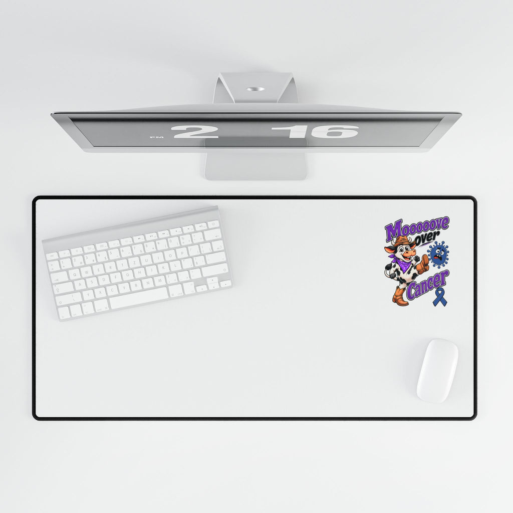 Desk mat with keyboard and mouse showing Moooove Over Cancer Colon Cancer awareness ribbon artwork