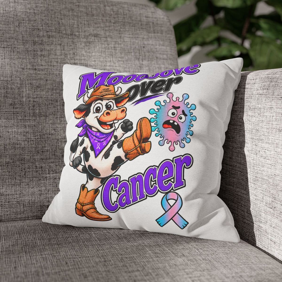 Team Victories pillowcases on a sofa, including Moooove Over Cancer and Thyroid Cancer awareness ribbon designs