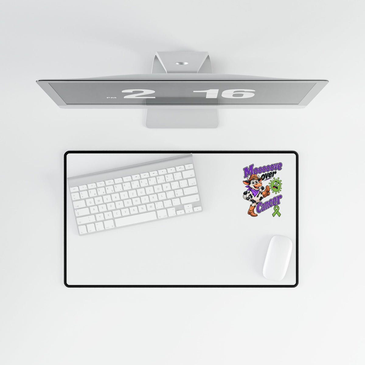 Moooove Over Cancer desk mat displayed beneath a keyboard and beside a mouse