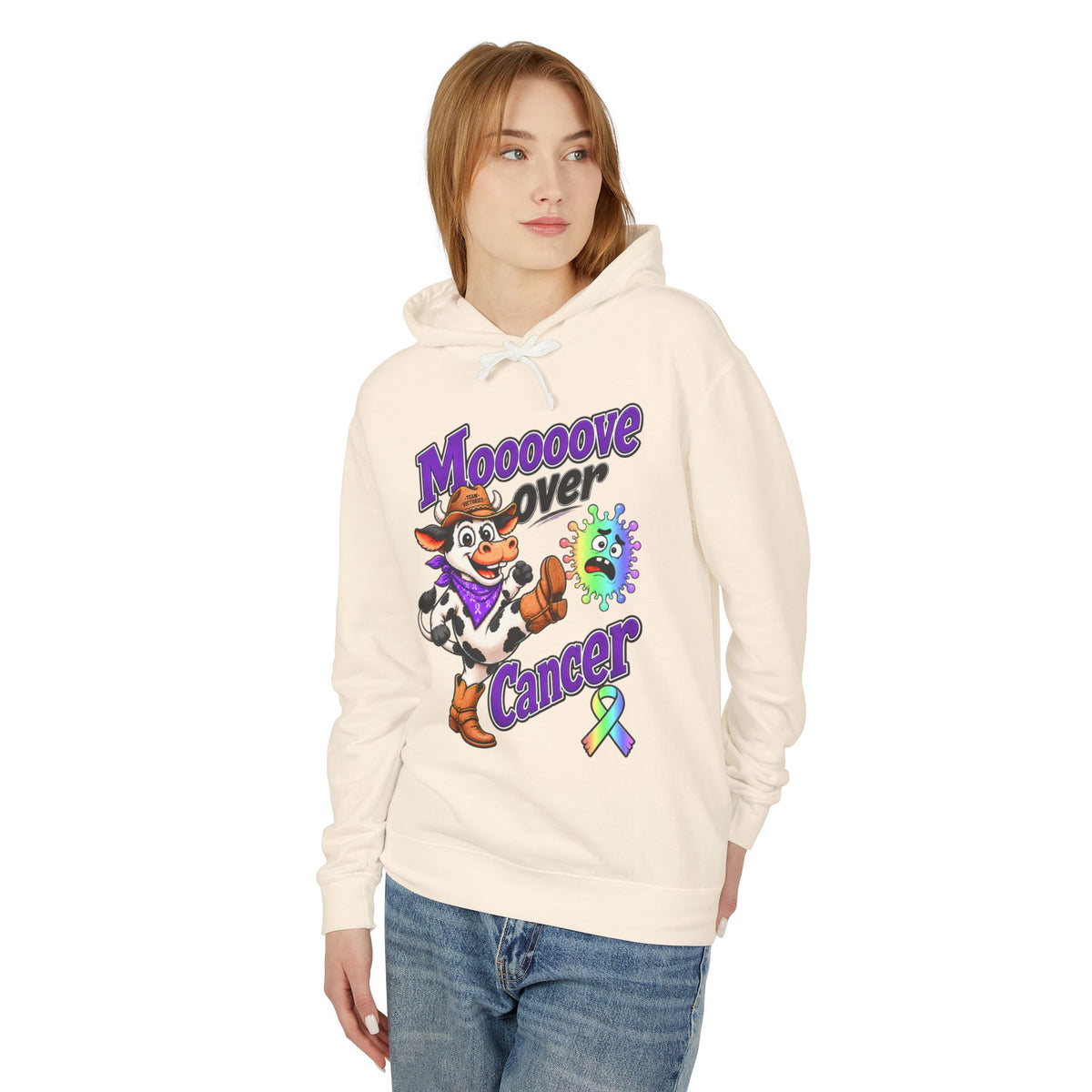 Model wearing a cream Moooove Over Cancer hoodie with colorful awareness artwork