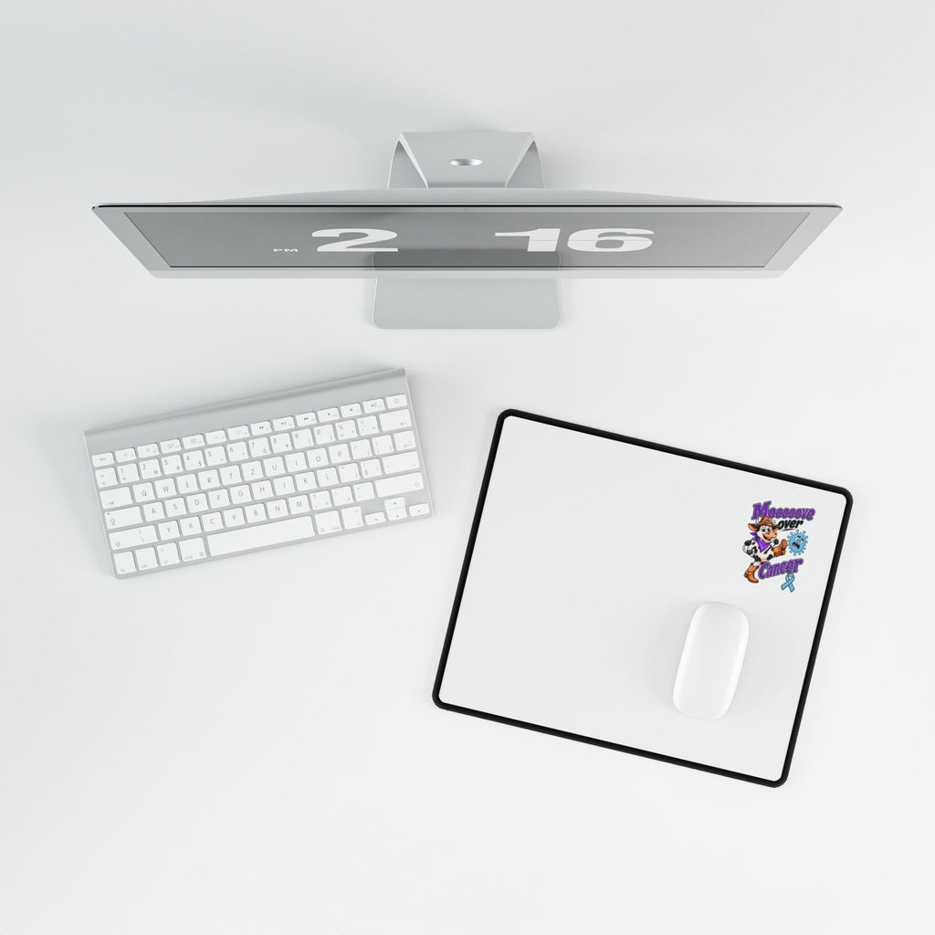 Moooove Over Cancer desk mat in a desktop setup with a computer mouse