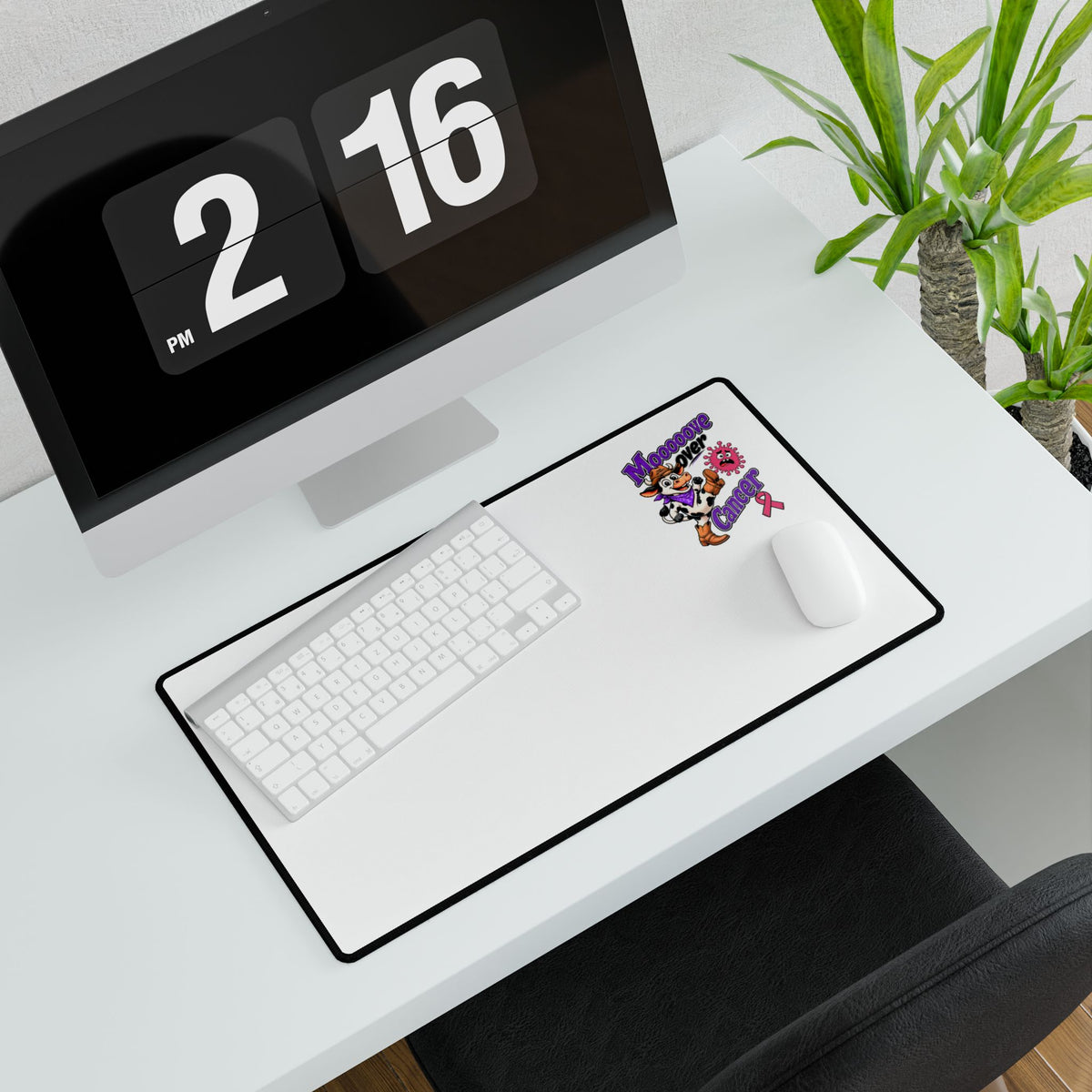 Moooove Over Cancer mouse pad shown in a modern office setup