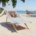 Kickin' Cancer beach towel with western boot artwork on a beach lounge chair