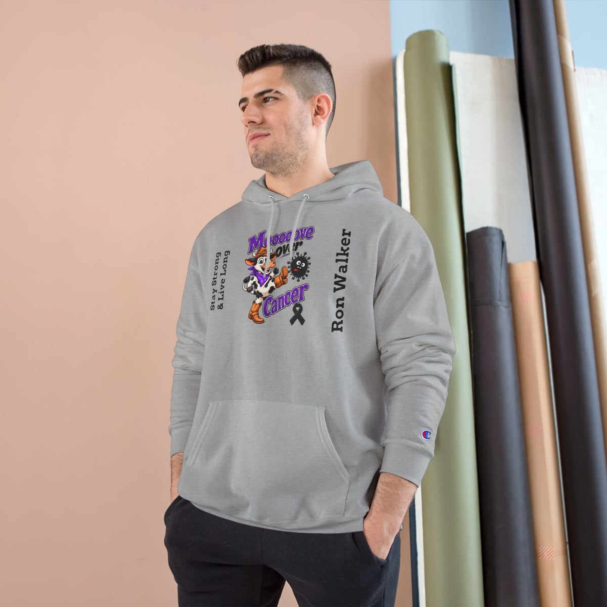 Model wearing gray Moooove Over Cancer personalized black ribbon hoodie