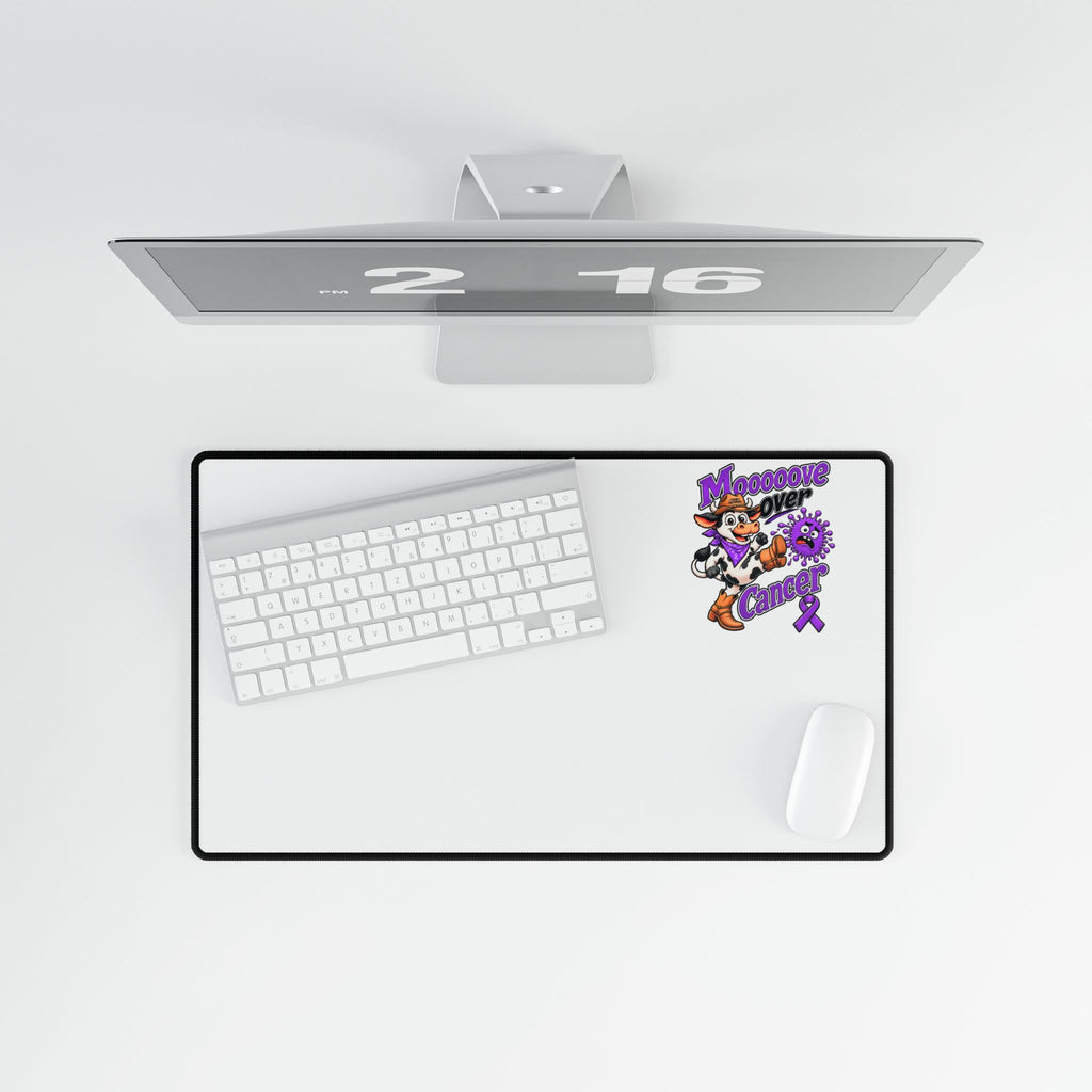 Moooove Over Cancer desk mat beneath a keyboard and beside a mouse