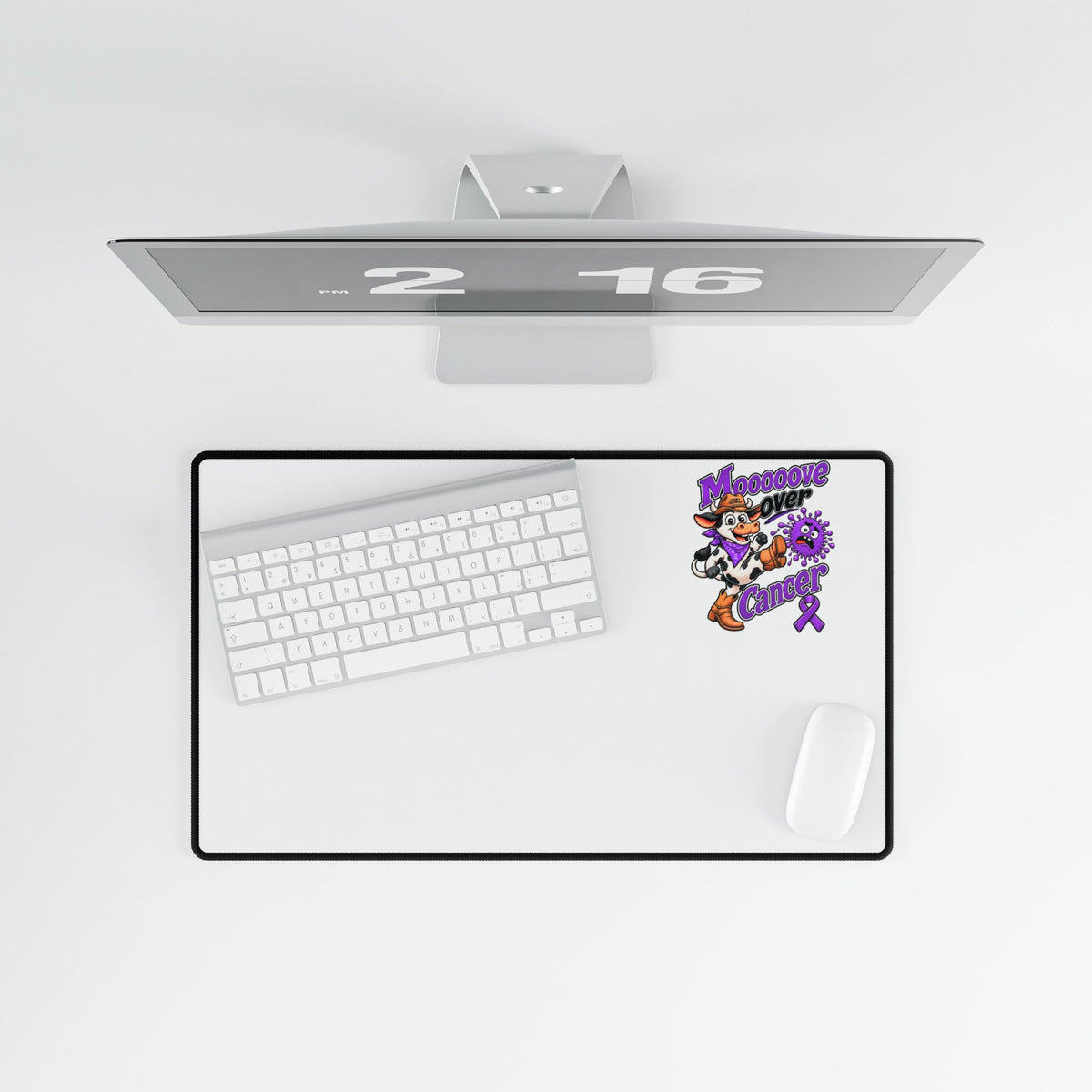 Moooove Over Cancer desk mat beneath a keyboard and beside a mouse