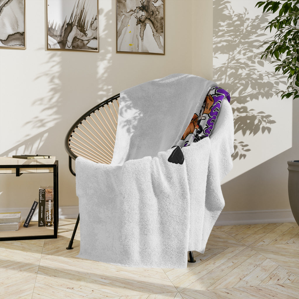 Moooove Over Cancer blanket hanging over a chair to show its plush texture