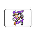 Moooove Over Cancer cow, purple lettering, and black ribbon on a white desk mat
