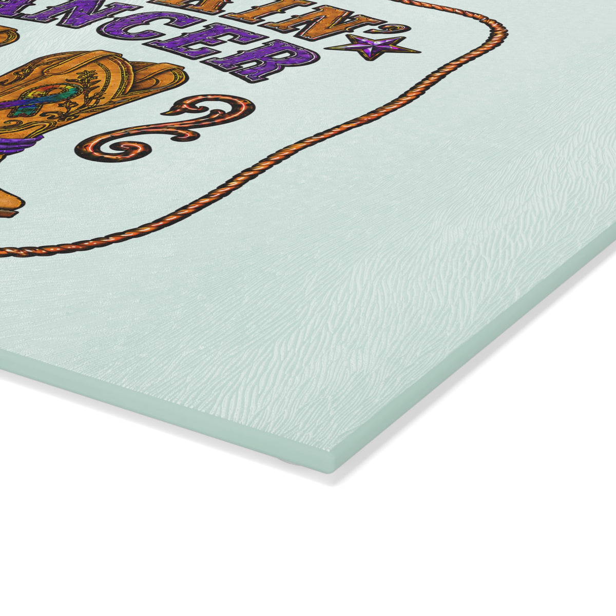 Close-up of the textured mint glass surface and printed rope border on the cutting board