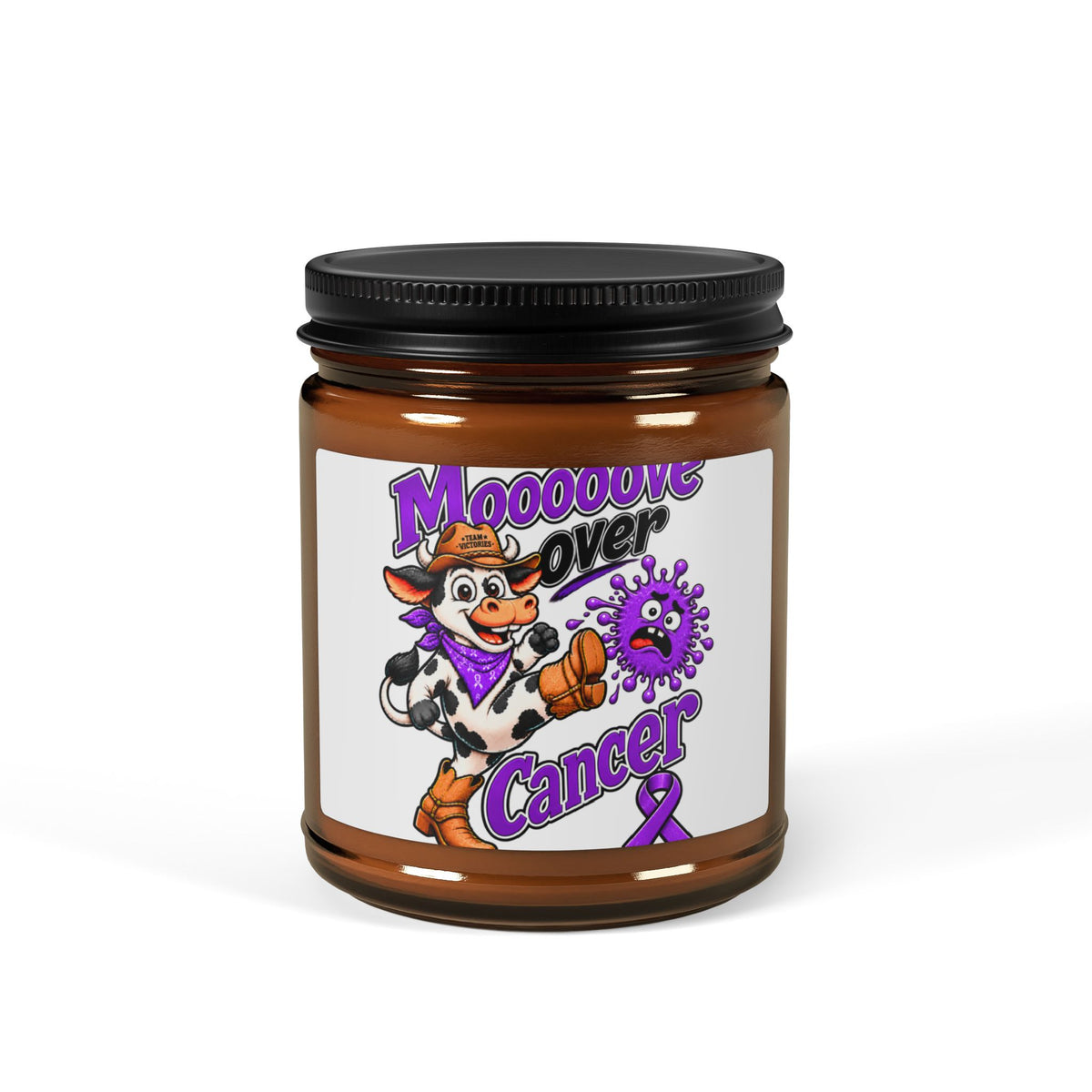 Close-up of Moooove Over Cancer amber jar candle and Pancreatic Cancer awareness ribbon label