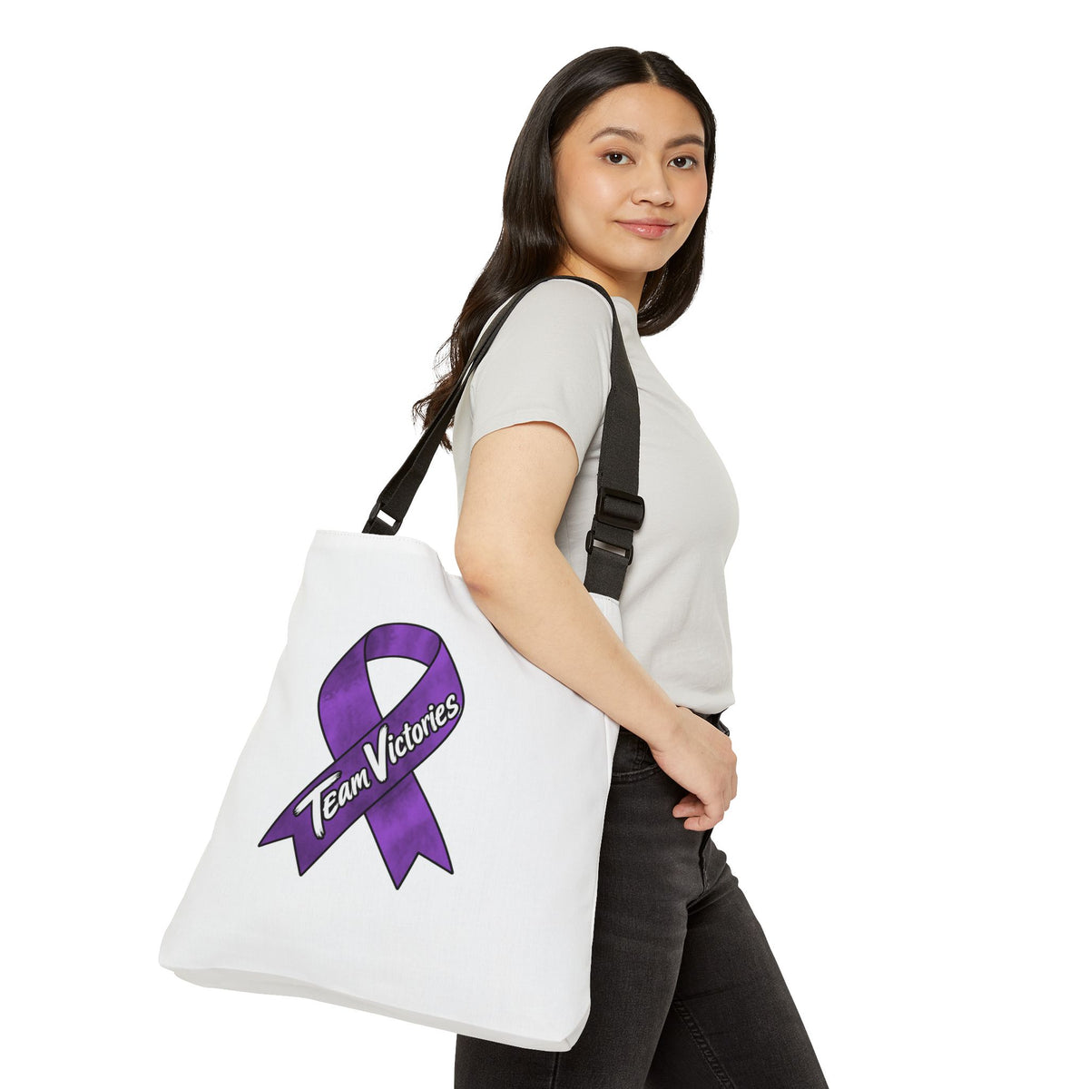 Team Victories purple ribbon shoulder tote worn from the side