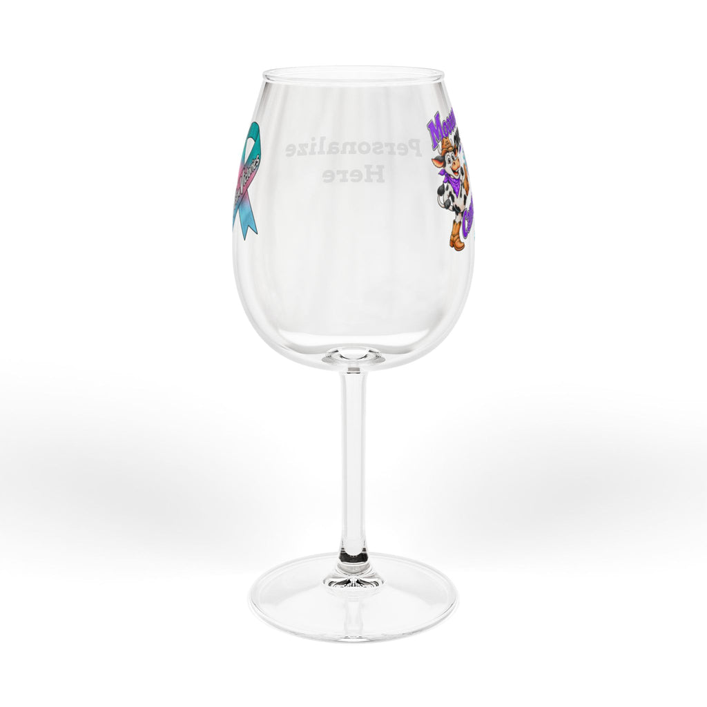 Side view of the Moooove Over Cancer artwork and ribbon on a wine glass