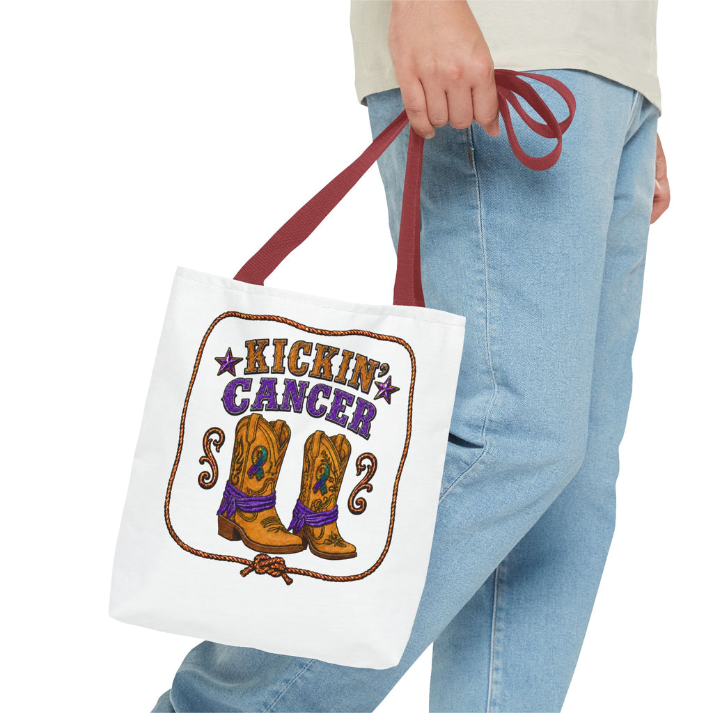 Person carrying a Kickin' Cancer cowboy boot tote bag with red handles