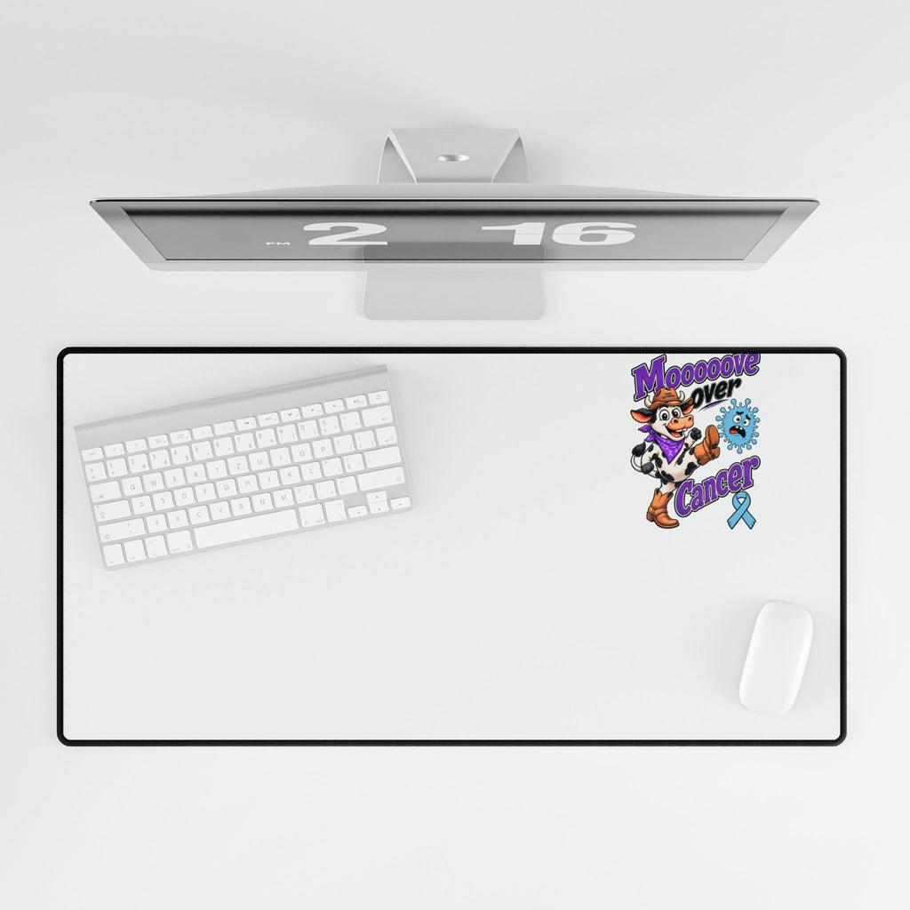 Top view of Moooove Over Cancer desk mat with colorful ribbon artwork