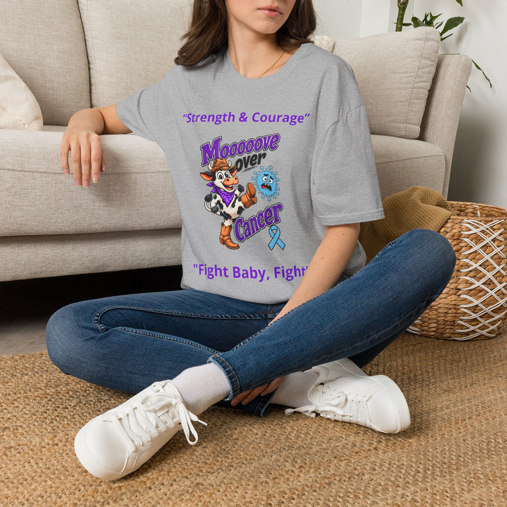 Woman wearing speckled cream Moooove Over Cancer T-shirt with Strength & Courage design