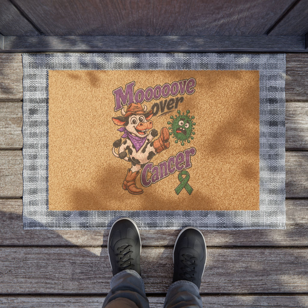 Moooove Over Cancer entry mat at a doorway, featuring a cow and green Liver Cancer awareness ribbon