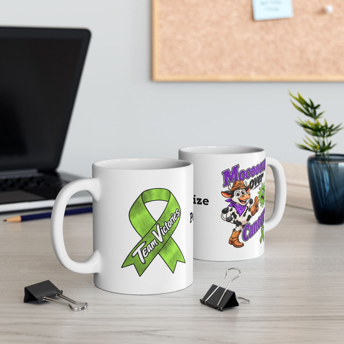 Moooove Over Cancer and Team Victories mugs displayed together on a desk