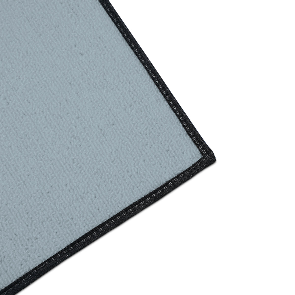 Close-up of polyester texture and black trim on Mooove Over Cancer mat