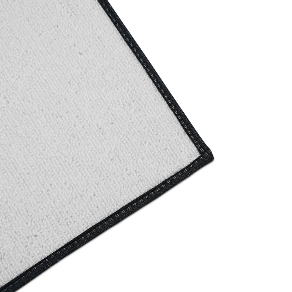 Detailed corner view of the Moooove Over Cancer mat with black trim