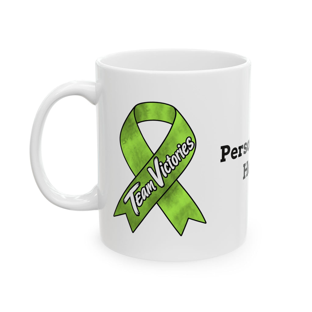 Team Victories ribbon design on the side of a Moooove Over Cancer ceramic mug